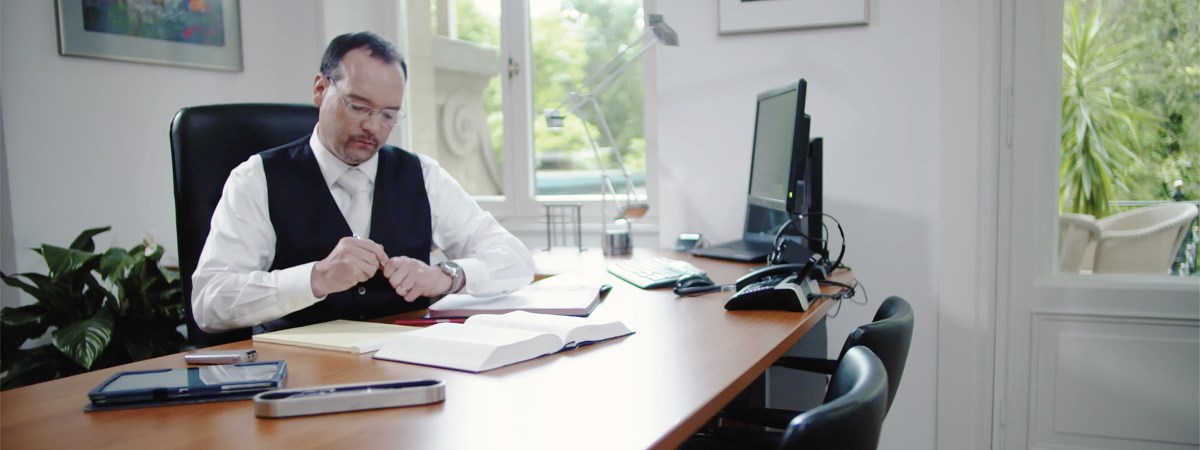 Specialist inheritance lawyer - Dr. Marcus Hosser TEP on his desk.